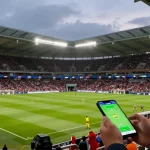 Exciting football betting scene with bj88-vnd showcasing live match odds and predictions.